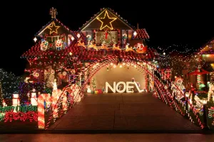 Installing professional Christmas lights on a home roofline